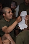 U.S. Marine Corps Recruit Jesus Macias, with Golf Company, 2nd Recruit Training Battalion, reads a letter he received at Marine Corps Recruit Depot San Diego, California, Mar. 11, 2024. Letters are the only means of communication between recruits and their loved ones and often serve as the only source of information from the outside world. (U.S. Marine Corps photo by Sgt. Jesse K. Carter-Powell)