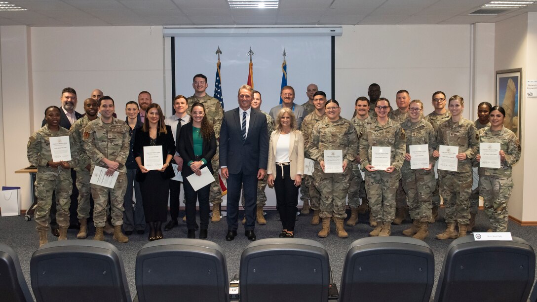 Jeffry L. Flake, U.S. Ambassador to Türkiye, and 39th Air Base Wing personnel gather after a recognition ceremony Dec. 12, 2023, at Incirlik Air Base, Türkiye. Ambassador Flake visited Incirlik AB to thank and recognize Airmen who demonstrated exceptional performance and responsiveness in support of the U.S. Mission to Türkiye, a key NATO ally.