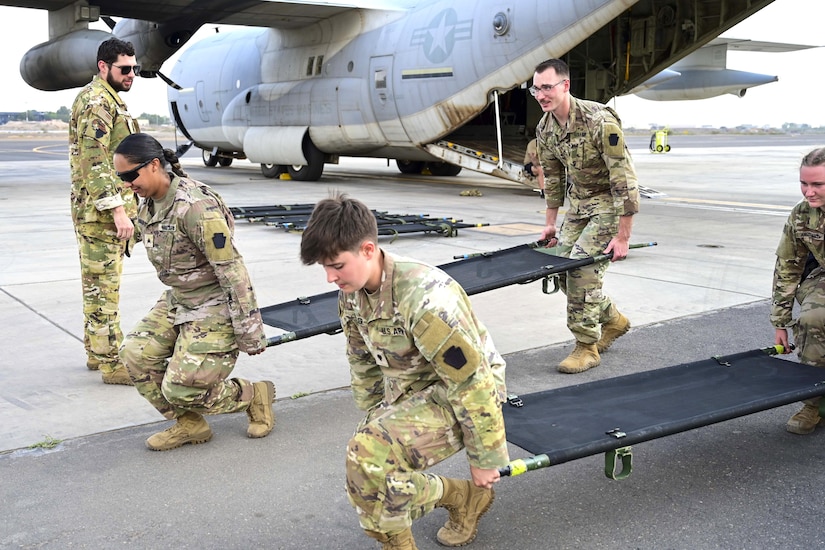 Combat medics from the 56th Stryker Brigade Combat Team who are deployed to the Horn of Africa conduct joint medical evacuation cold-load training aboard a KC-130J aircraft at Camp Lemonnier, Djibouti, March 5, 2024. The purpose of the training is to ensure interoperability with key U.S. military assets to expedite patient transfers to and from an aircraft in the event life saving measures and medical evacuation are requested. (U.S. Army National Guard photo by Capt. Amanda Mayer)