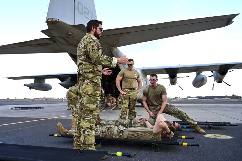 Combat medics from the 56th Stryker Brigade Combat Team who are deployed to the Horn of Africa conduct joint medical evacuation cold-load training aboard a KC-130J aircraft at Camp Lemonnier, Djibouti, March 5, 2024. The purpose of the training is to ensure interoperability with key U.S. military assets to expedite patient transfers to and from an aircraft in the event life saving measures and medical evacuation are requested. (U.S. Army National Guard photo by Capt. Amanda Mayer)
