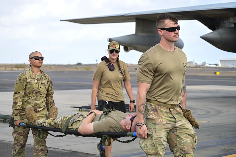 Combat medics from the 56th Stryker Brigade Combat Team who are deployed to the Horn of Africa conduct joint medical evacuation cold-load training aboard a KC-130J aircraft at Camp Lemonnier, Djibouti, March 5, 2024. The purpose of the training is to ensure interoperability with key U.S. military assets to expedite patient transfers to and from an aircraft in the event life saving measures and medical evacuation are requested. (U.S. Army National Guard photo by Capt. Amanda Mayer)