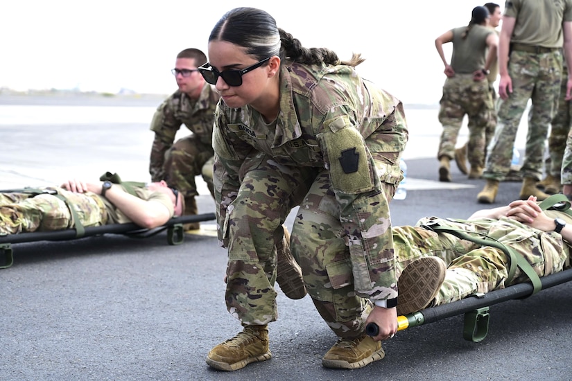 Combat medics from the 56th Stryker Brigade Combat Team who are deployed to the Horn of Africa conduct joint medical evacuation cold-load training aboard a KC-130J aircraft at Camp Lemonnier, Djibouti, March 5, 2024. The purpose of the training is to ensure interoperability with key U.S. military assets to expedite patient transfers to and from an aircraft in the event life saving measures and medical evacuation are requested. (U.S. Army National Guard photo by Capt. Amanda Mayer)
