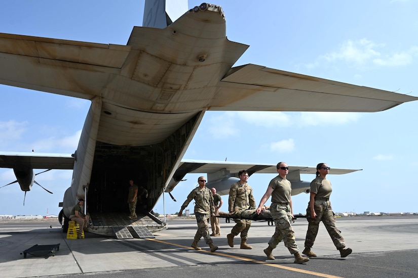 Combat medics from the 56th Stryker Brigade Combat Team who are deployed to the Horn of Africa conduct joint medical evacuation cold-load training aboard a KC-130J aircraft at Camp Lemonnier, Djibouti, March 5, 2024. The purpose of the training is to ensure interoperability with key U.S. military assets to expedite patient transfers to and from an aircraft in the event life saving measures and medical evacuation are requested. (U.S. Army National Guard photo by Capt. Amanda Mayer)