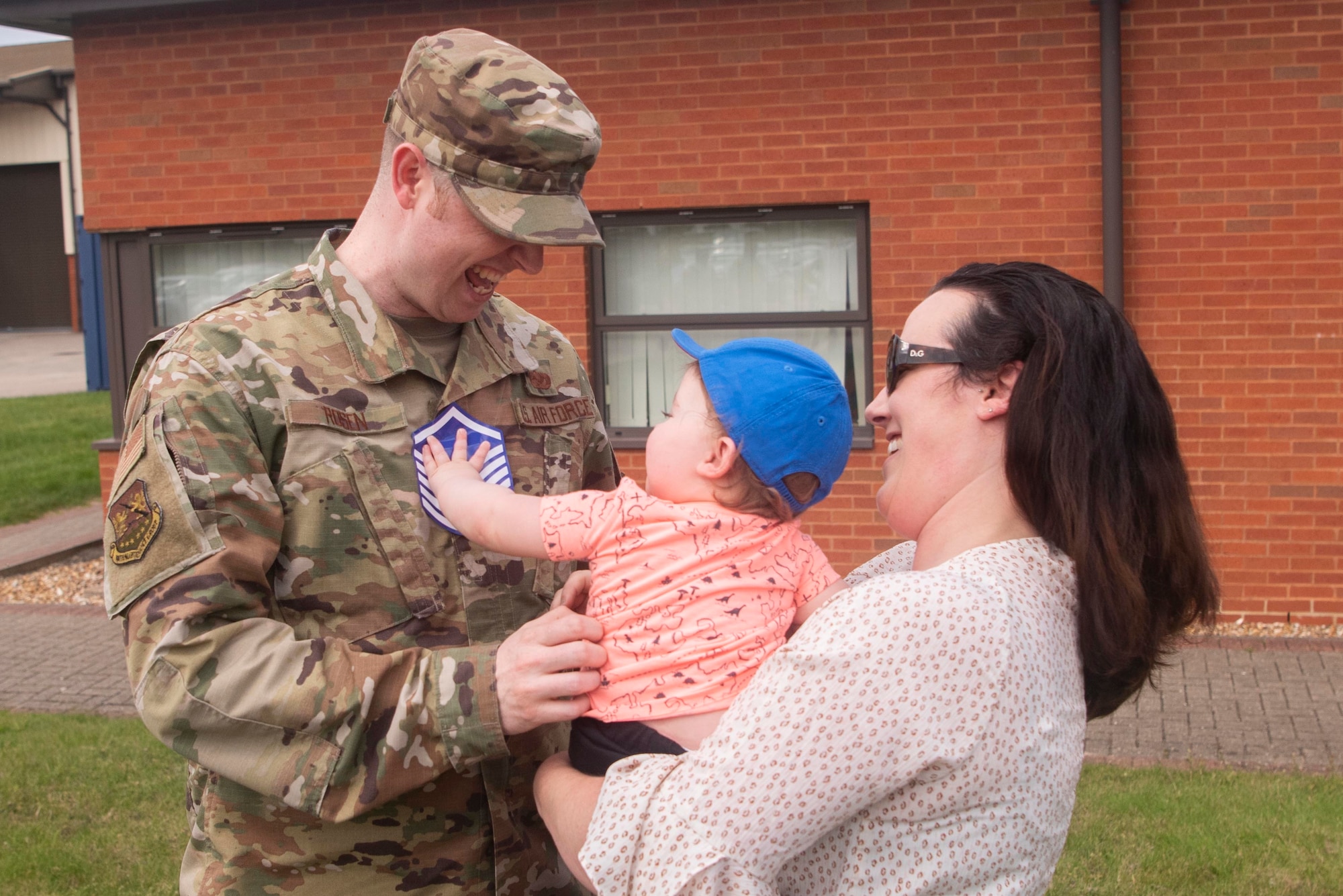 A newly selected master sergeant celebrates with his family July 24, 2020, at RAF Mildenhall, England. Promotion to master sergeant marks the entry into the final tier of the enlisted force structure. (U.S. Air Force photo by Airman 1st Class Joseph Barron)