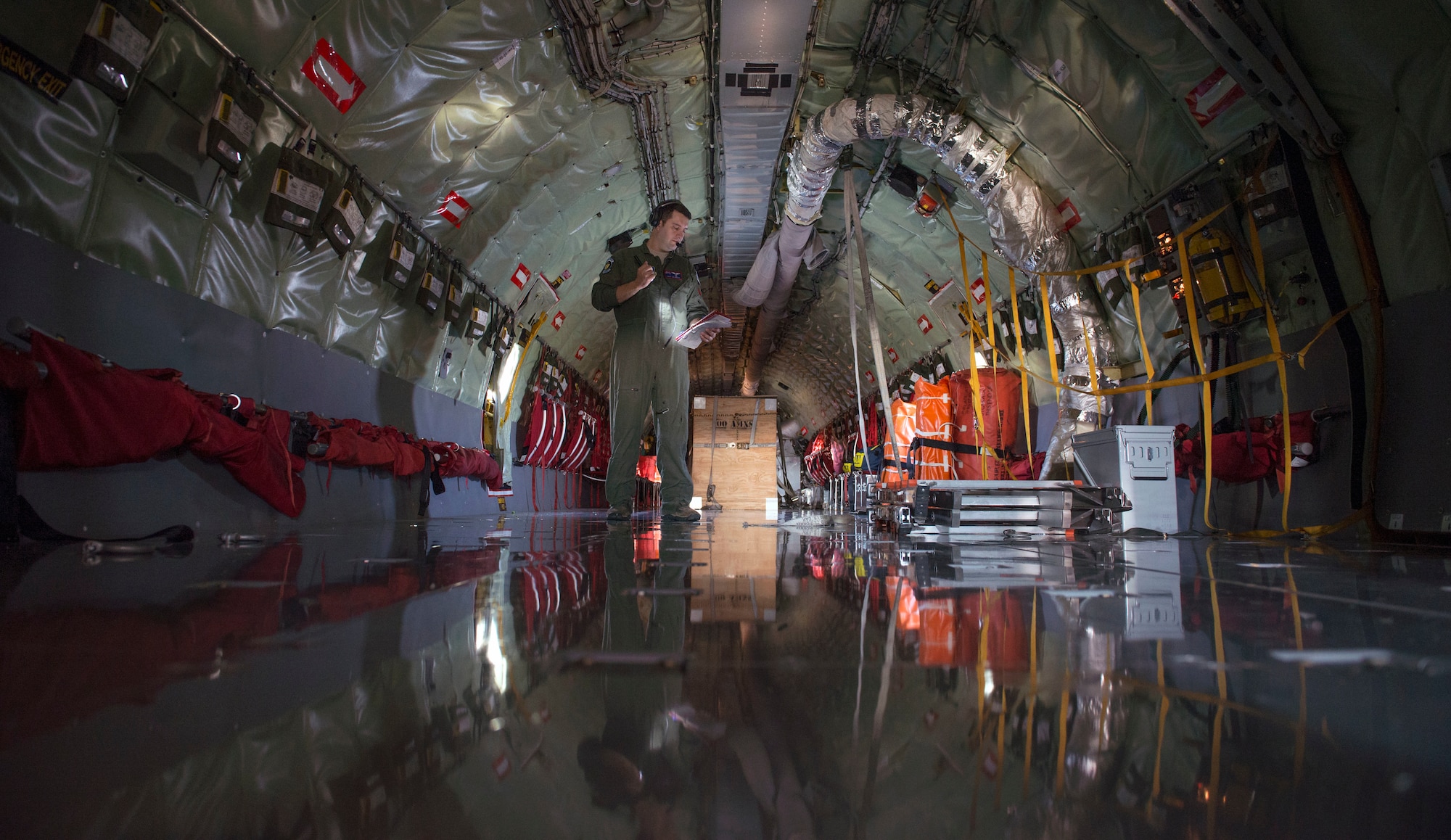 U.S. Air Force Staff Sgt. Juan Upegui, 351st Air Refueling Wing boom operator, conducts pre-flight checks prior to an air refueling mission for a large forces exercise, at RAF Mildenhall, England, Oct. 10, 2018. RAF Lakenheath hosted the exercise, which took place in the U.S. European Command area of operations. (U.S. Air Force photo by Staff Sgt. Christine Groening)