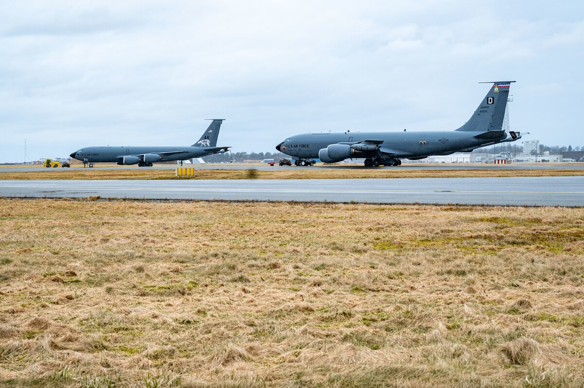 A U.S. Air Force KC-135 Stratotanker assigned to the 100th Air Refueling Wing, right, sits next to a 168th Wing, Alaska Air National Guard KC-135, left, at Sola Air Station, Stavanger, Norway, March 13, 2024.