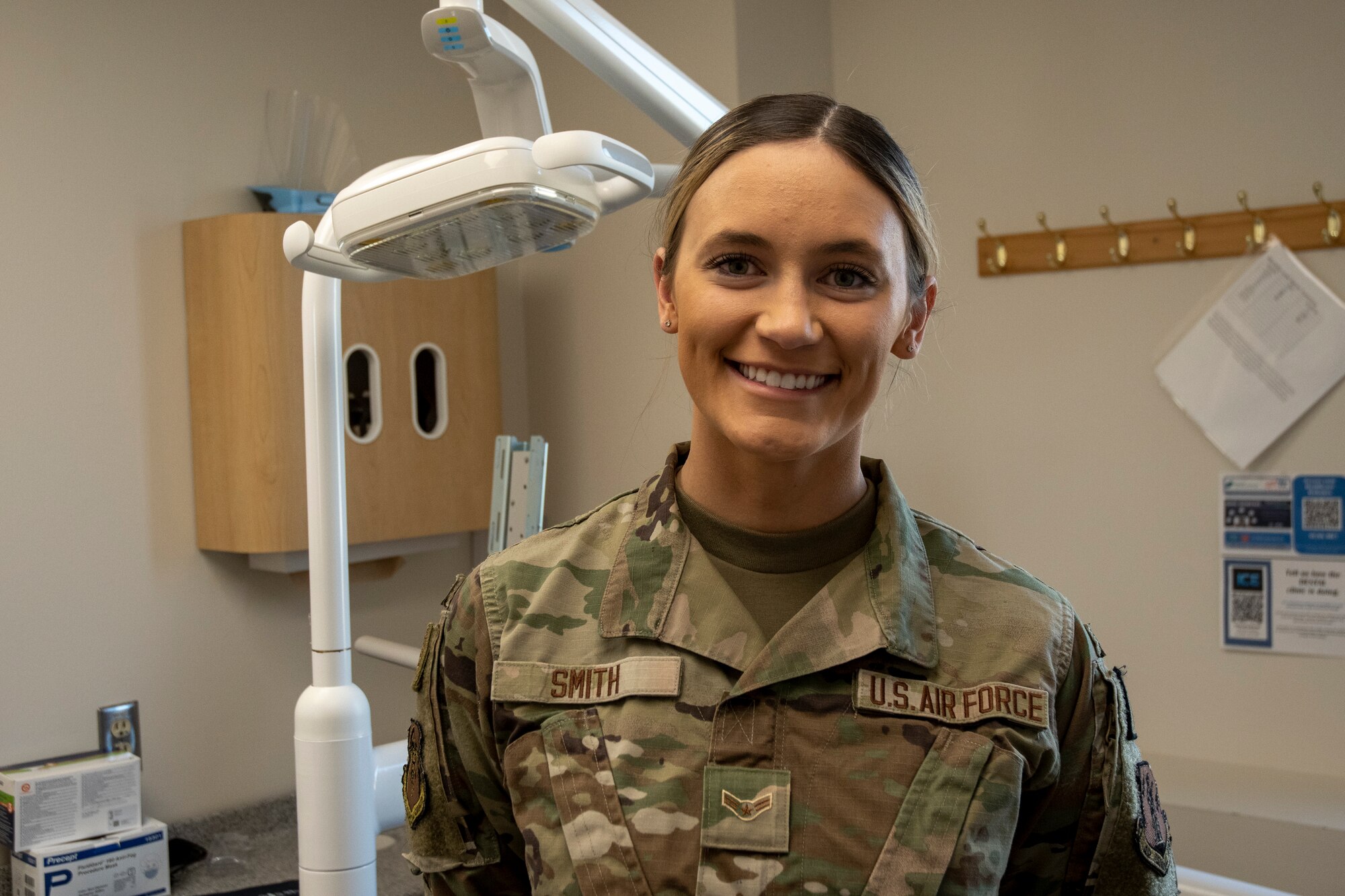 Portrait of a U.S. Air Force Airman poses for a photo of a Portrait in OCP patterned uniform in a dental office