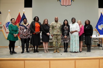 Defense Logistics Agency Troop Support Commander Army General Landis Maddox poses with Women’s History Month panelists in Philadelphia on March 13. Panelists answered an array of questions related to their professional experiences as women in the workforce during a question-and-answer session. Photo by Edward Moldonado.