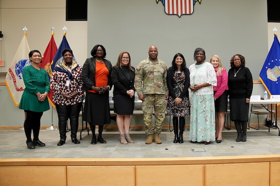 Defense Logistics Agency Troop Support Commander Army General Landis Maddox poses with Women’s History Month panelists in Philadelphia on March 13. Panelists answered an array of questions related to their professional experiences as women in the workforce during a question-and-answer session. Photo by Edward Moldonado.