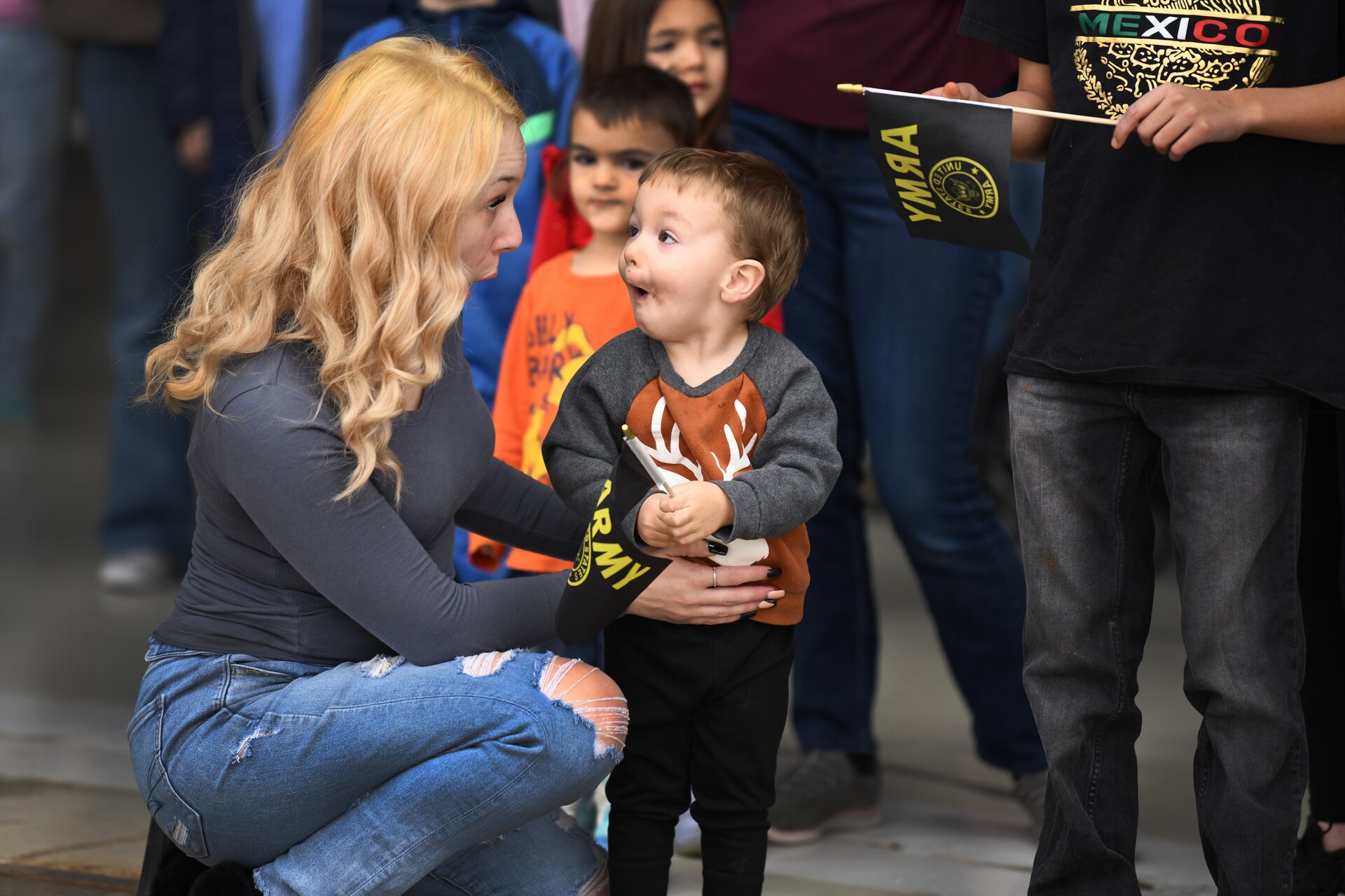 Waylon reacts to his father, Sergeant Luke Isaacson , A Battery, 182nd Field Artillery, Michigan National Guard, as he sees him de-boarding the plane at the units welcome home ceremony from their recent deployment overseas, Detroit, Mich, Feb. 8, 2024.(U.S. Army photo by Master Sgt. Helen Miller)
