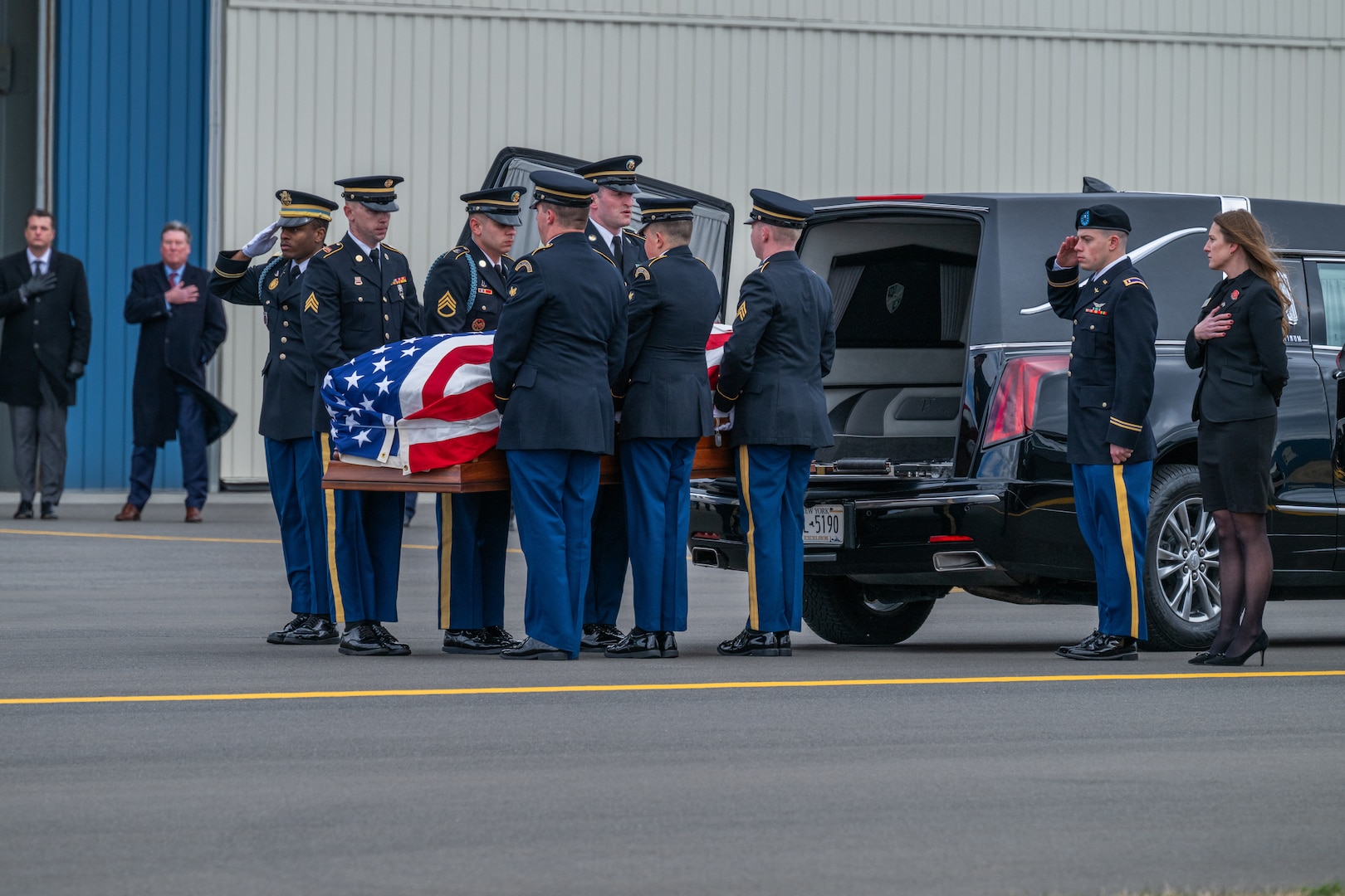 A New York Army National Guard Honor Guard team places the remains of Chief Warrant Officer 2 Casey Frankoski into a hearse during plane-side honors at the Army Aviation Support Facility in Latham, New York, March 18, 2024. Frankoski and Chief Warrant Officer 2 John M. Grassia III were killed in a March 8 helicopter crash in Texas.