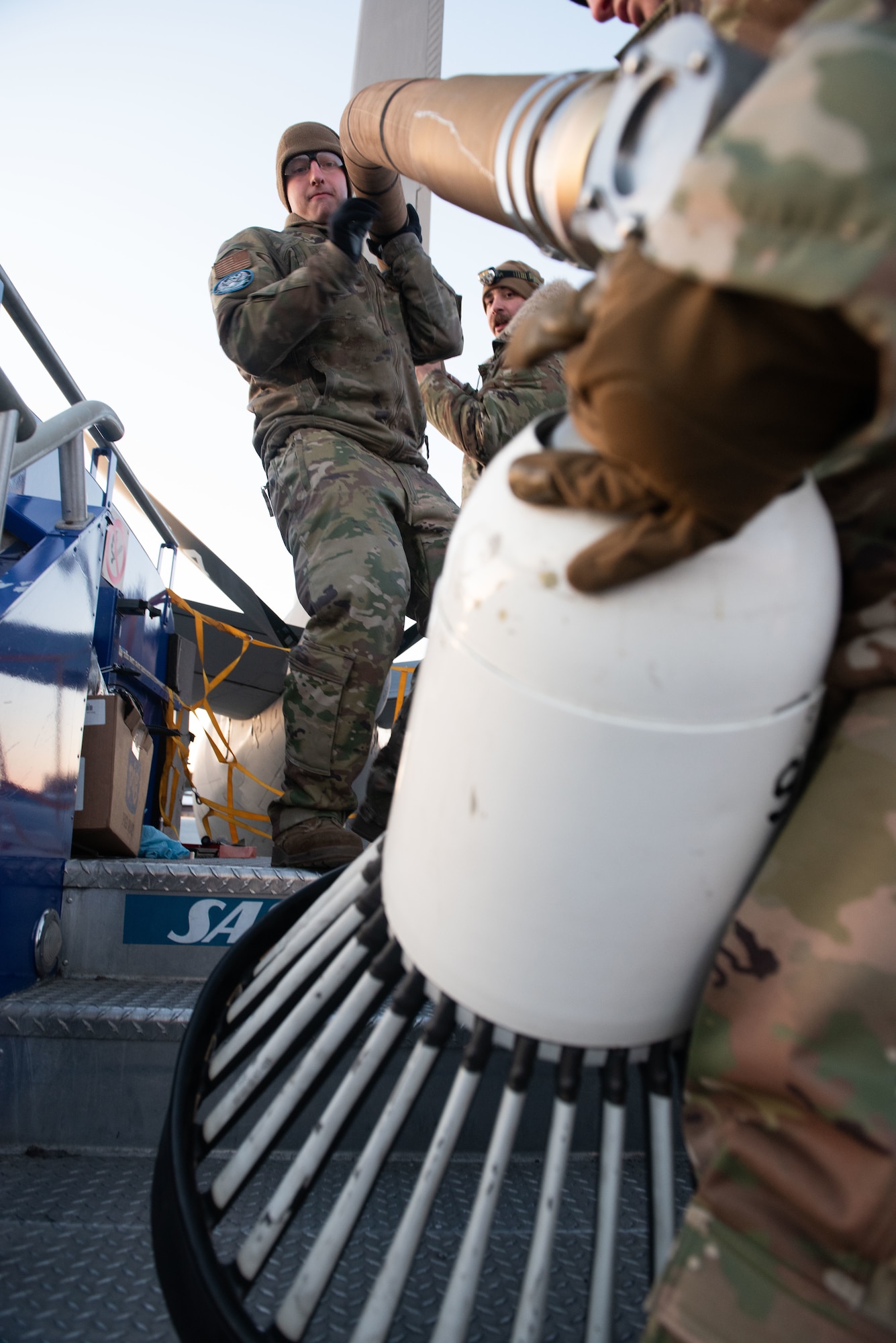 Maintenance Airmen install the drogue