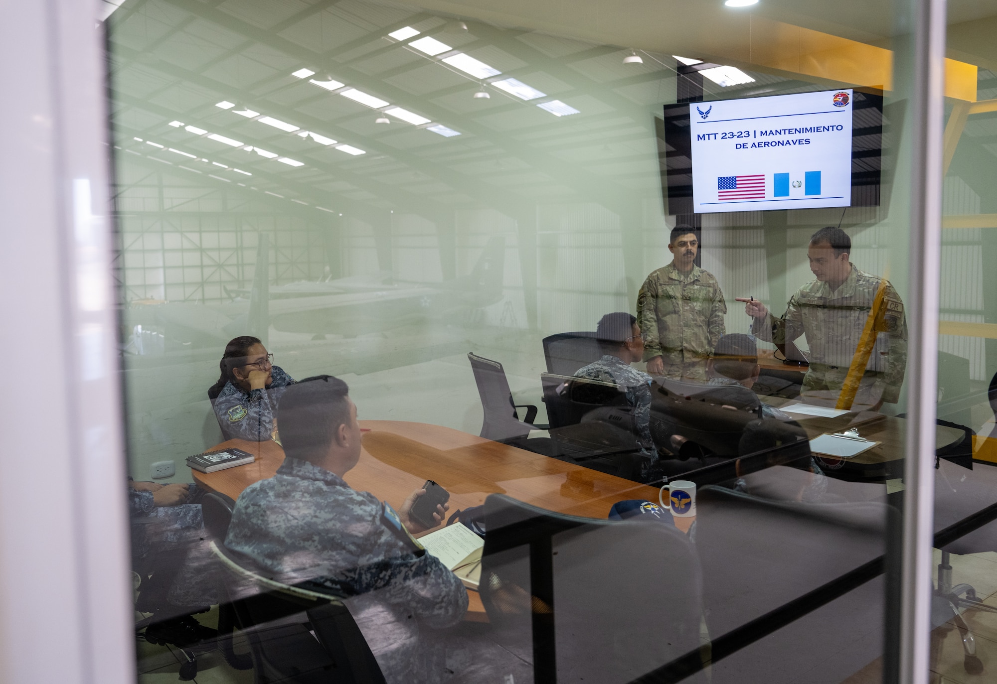 U.S. Staff Sgt. Dylan Sanchez, top middle, and U.S. Air Force Master Sgt. Felipe Pent, top right, both 571st Mobility Support Advisory Squadron air advisors, teach a class about aircraft maintenance together on Comando Aéreo Central “La Aurora” in Guatemala City, Guatemala, Feb. 26, 2024.