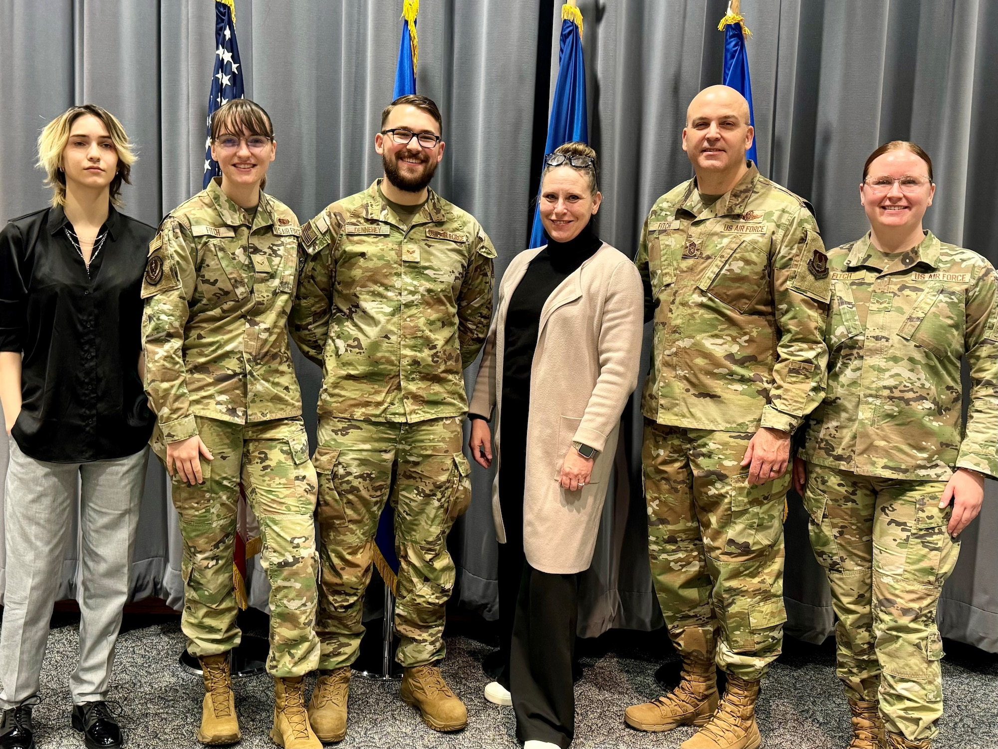 Chief Master Sgt. James (Bill) E. Fitch II poses for a photo with his family.