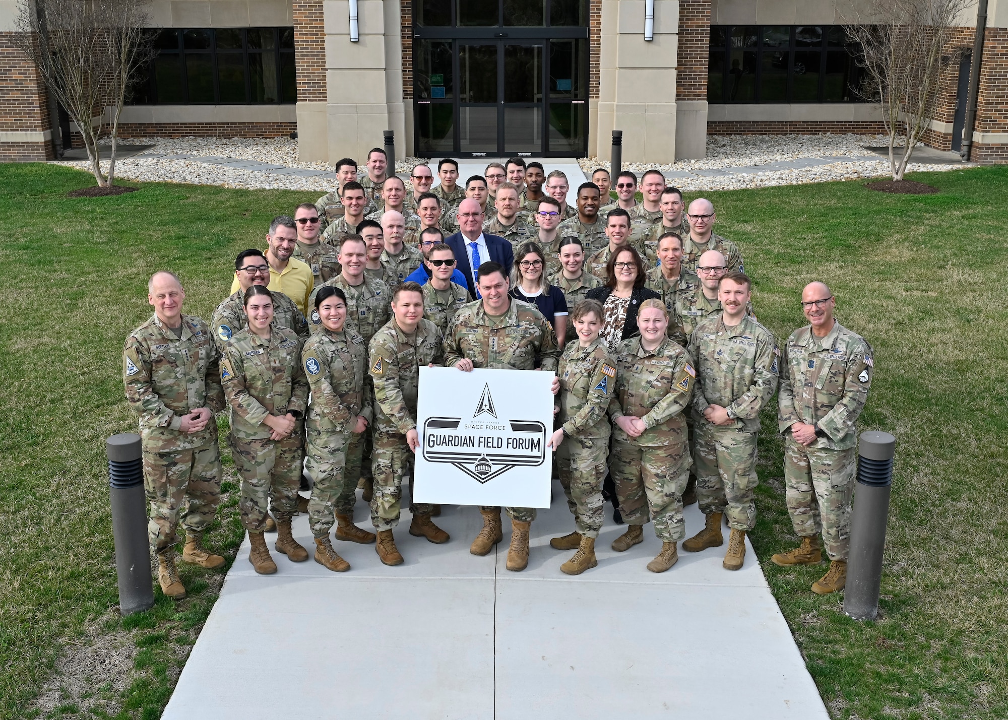 Chief of Space Operations Gen. Chance Saltzman, center, poses with attendees of the Guardian Field Forum at Joint Base Andrews, Md., March 15, 2024. The forum is a week-long event that brings together junior Guardians and senior Space Force leaders to collaborate on initiatives to improve the Space Force. (U.S. Air Force photo by Eric Dietrich)