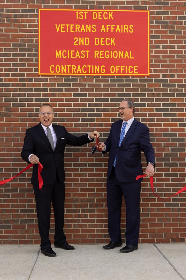 Mr. Michael Scalise, left, executive director, Marine Corps Installations East-Marine Corps Base (MCB) Camp Lejeune, and Mr. Mark Bilosz, Winston-Salem Veterans Affairs (VA) Regional Benefit Office director, cut a ribbon during the VA Benefits Delivery at Discharge (BDD) Intake Site ribbon cutting ceremony on MCB Camp Lejeune, North Carolina, March 18, 2024. The new VA BDD Intake Site, located at Bldg. 316 on G Street, supports service members through the BDD process, allowing service members to file a claim for service-connected disabilities up to 180 days prior to separation. The BDD site also supports service members going through the Integrated Disability Evaluation System process and veterans seeking support from the VA. (U.S. Marine Corps photo by Lance Cpl. Alyssa J. DeCrane)