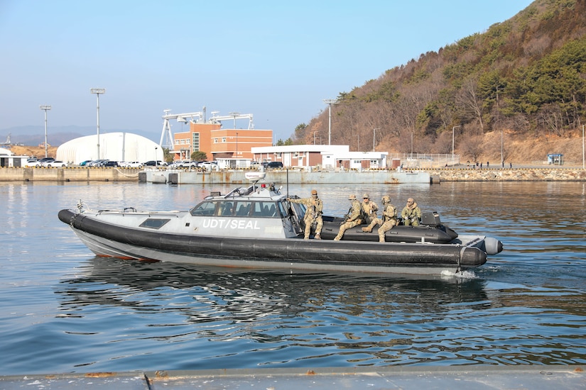 South Korean troops ride in a small boat.