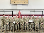 Members of Hotel Company, 132nd Brigade Support Battalion, stand together for a group photo following their participation in the 56th Philip A. Connelly culinary competition at their Eau Claire armory on March 17, 2024. This Wisconsin Army National Guard unit was just one of four units that made it to the final level of the competition for fiscal year 24. (U.S. National Guard photo by Sgt. Nina Kowalkowski)