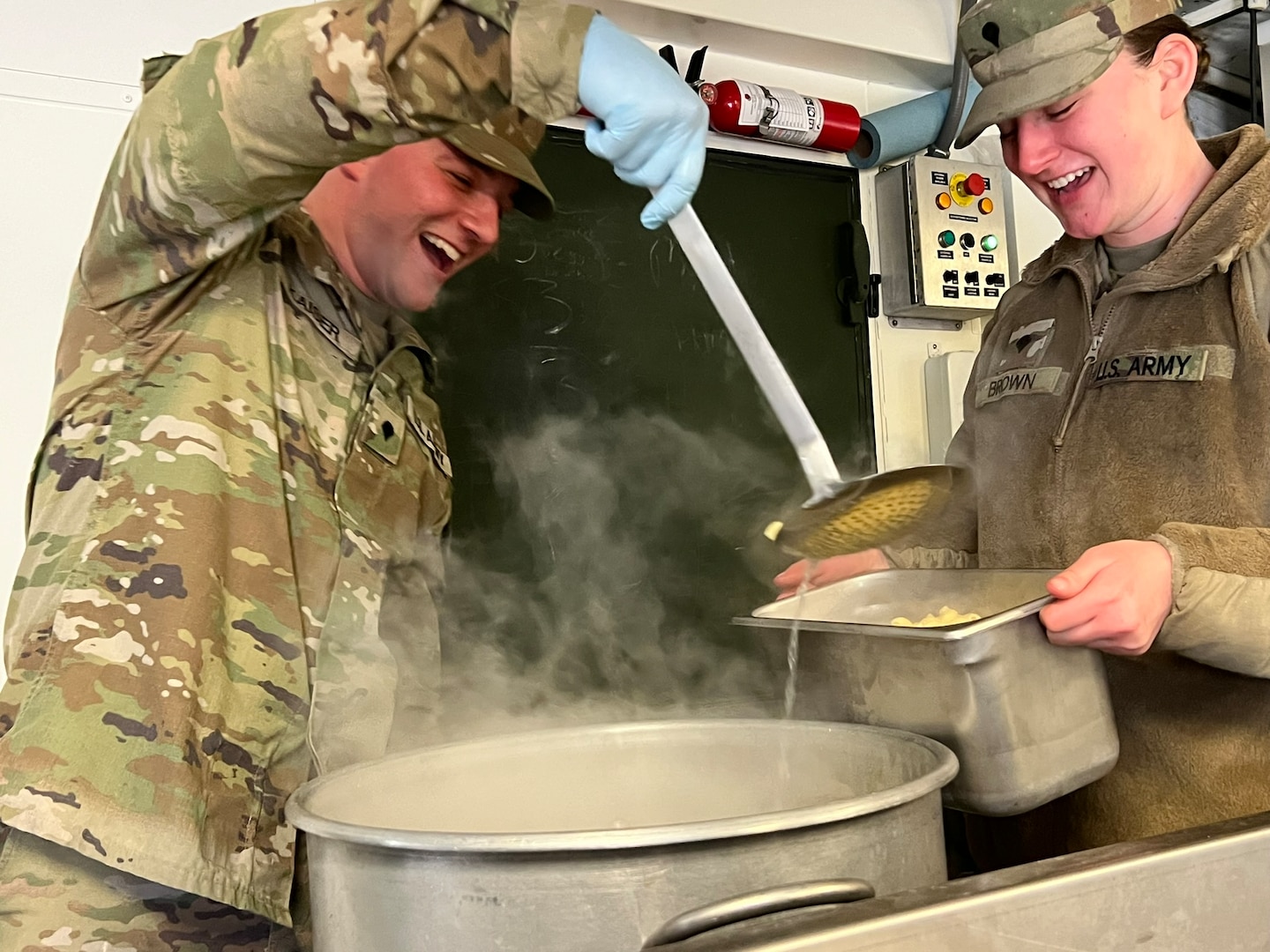 Spc. Garrett Kaiser (left) and Spc. Shelby Jo Brown (right) prepare the pasta portion of their breaded shrimp lunch for critique during the 56th Philip A. Connelly culinary competition at their Eau Claire armory on March 17, 2024. This Wisconsin Army National Guard unit was just one of four units that made it to the final level of the competition for fiscal year 24. (U.S. National Guard photo by Sgt. Nina Kowalkowski)