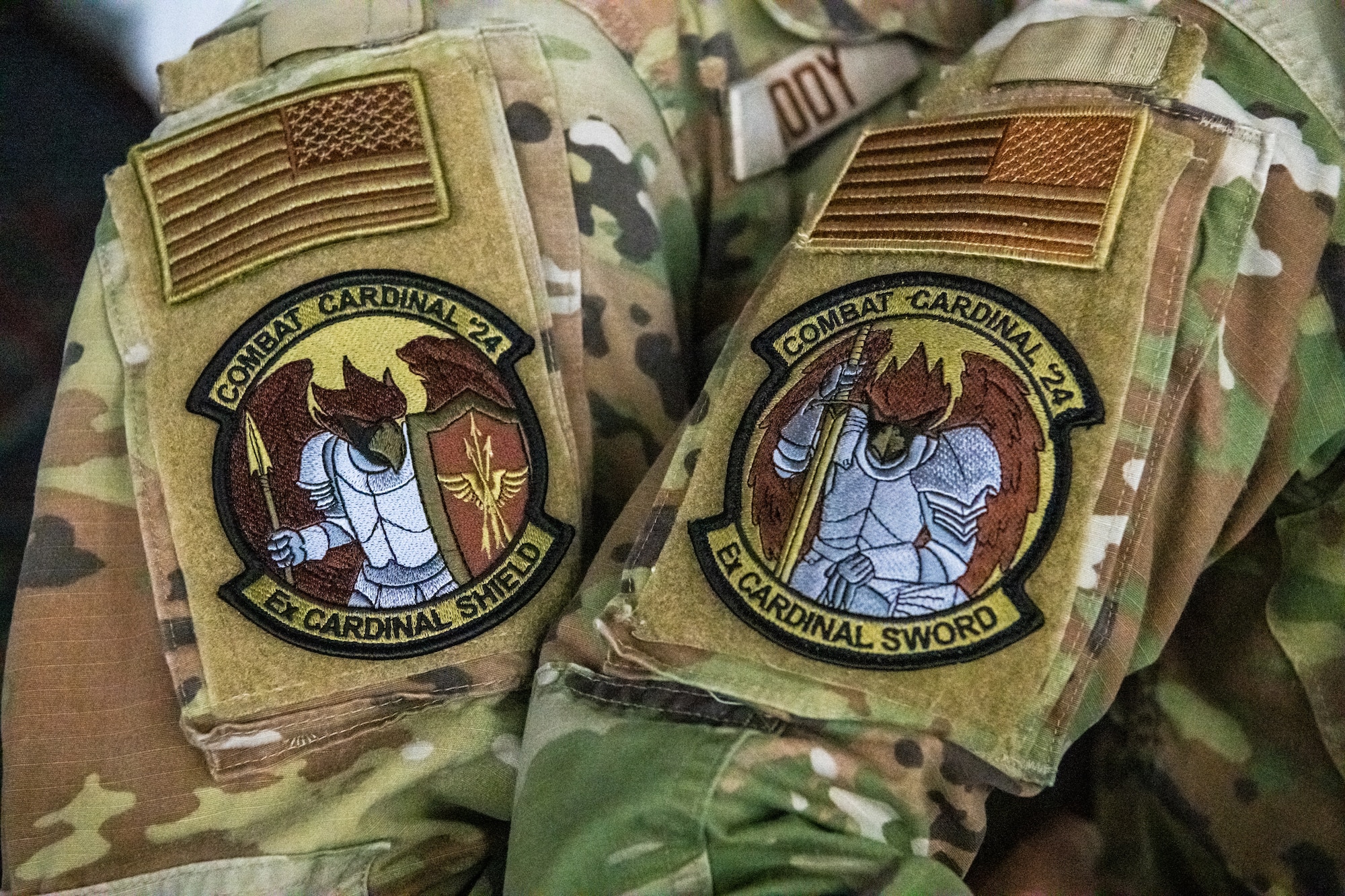 Airmen wear morale patches for Combat Cardinal