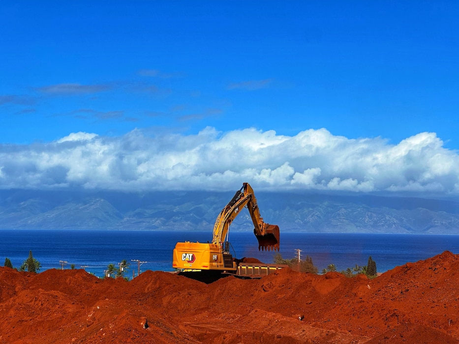 Construction equipment at the site of a temporary elementary school near Kaʻanapali, Hawaiʻi, Nov. 25, 2023. This temporary school will replace one that was destroyed in the wildfires on the island of Maui on Aug. 8, 2023. Mountains on the island of Molokaʻi can be seen in the background. Photo by Karyn Matthews, emergency manager, Emergency Management Branch. Matthews was on Maui in support of the Hawai‘i Wildfires Recovery mission.