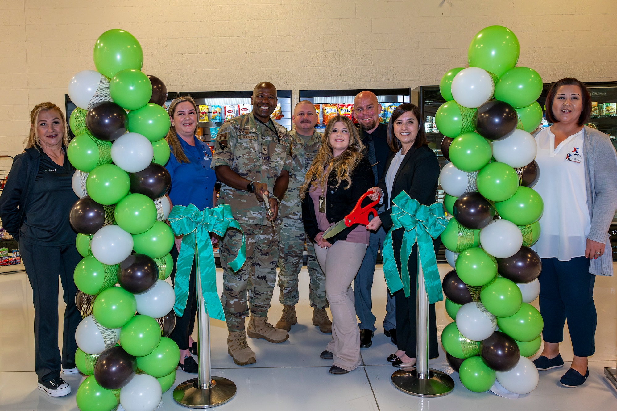 Col. Ahave Brown, 412th Maintenance Group commander, joins AAFES as they officially open a Self Service Market inside Building 1600 on Edwards Air Force Base, California, today. AAFES also opened two other locations on Edwards: one at the South Base facility and another at the Air Force Test Pilot School. The self service markets are a product of the Vanguard Program which saw a need to provide more food services on base and determined the three key locations.