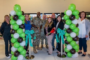 Col. Ahave Brown, 412th Maintenance Group commander, joins AAFES as they officially open a Self Service Market inside Building 1600 on Edwards Air Force Base, California, today. AAFES also opened two other locations on Edwards: one at the South Base facility and another at the Air Force Test Pilot School. The self service markets are a product of the Vanguard Program which saw a need to provide more food services on base and determined the three key locations.