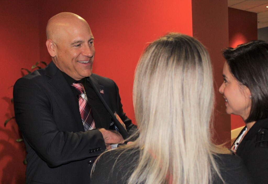Eric Ravelli, deputy of the Office of Small Business Programs with the U.S. Army Corps of Engineers Los Angeles District, left, speaks with participants at the Business Opportunities Open House March 13 at the Midtown Hilton Garden Inn in Phoenix. Small businesses represented more than 75 percent of the participants. This is Ravelli’s seventh year hosting the event for the LA District.