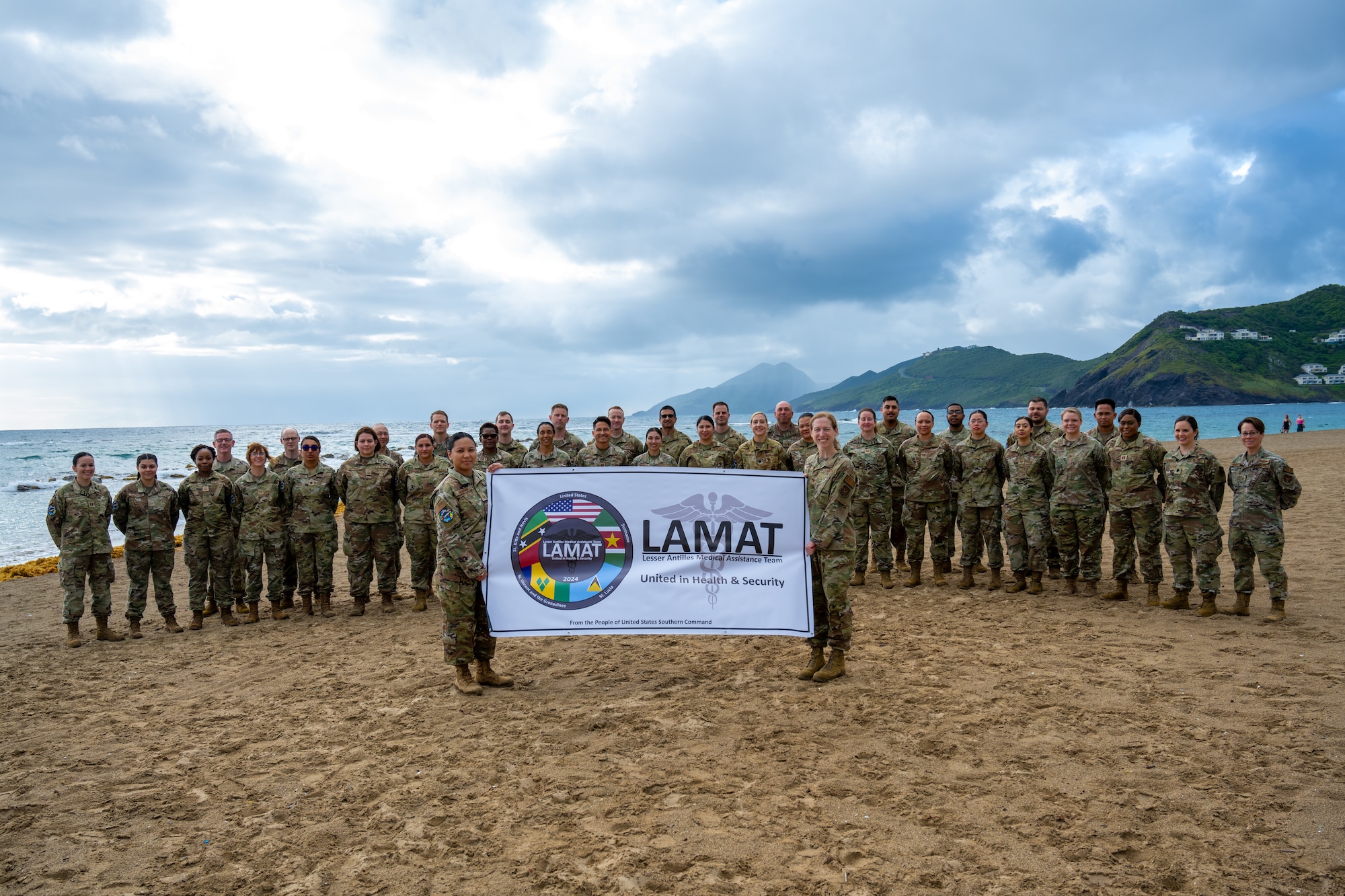 U.S. Air Force active-duty and reserve Airmen pose for a group photo during the Lesser Antilles Medical Assistance Team mission in St. Kitts and Nevis, March 17, 2024. This was the first opportunity for the U.S. Southern Command directed medical team to collaborate and partner with St. Kitts and Nevis medical professionals to deliver support and resources to the island nation and its healthcare system. (U.S. Air Force photo by Senior Airman John Rossi)