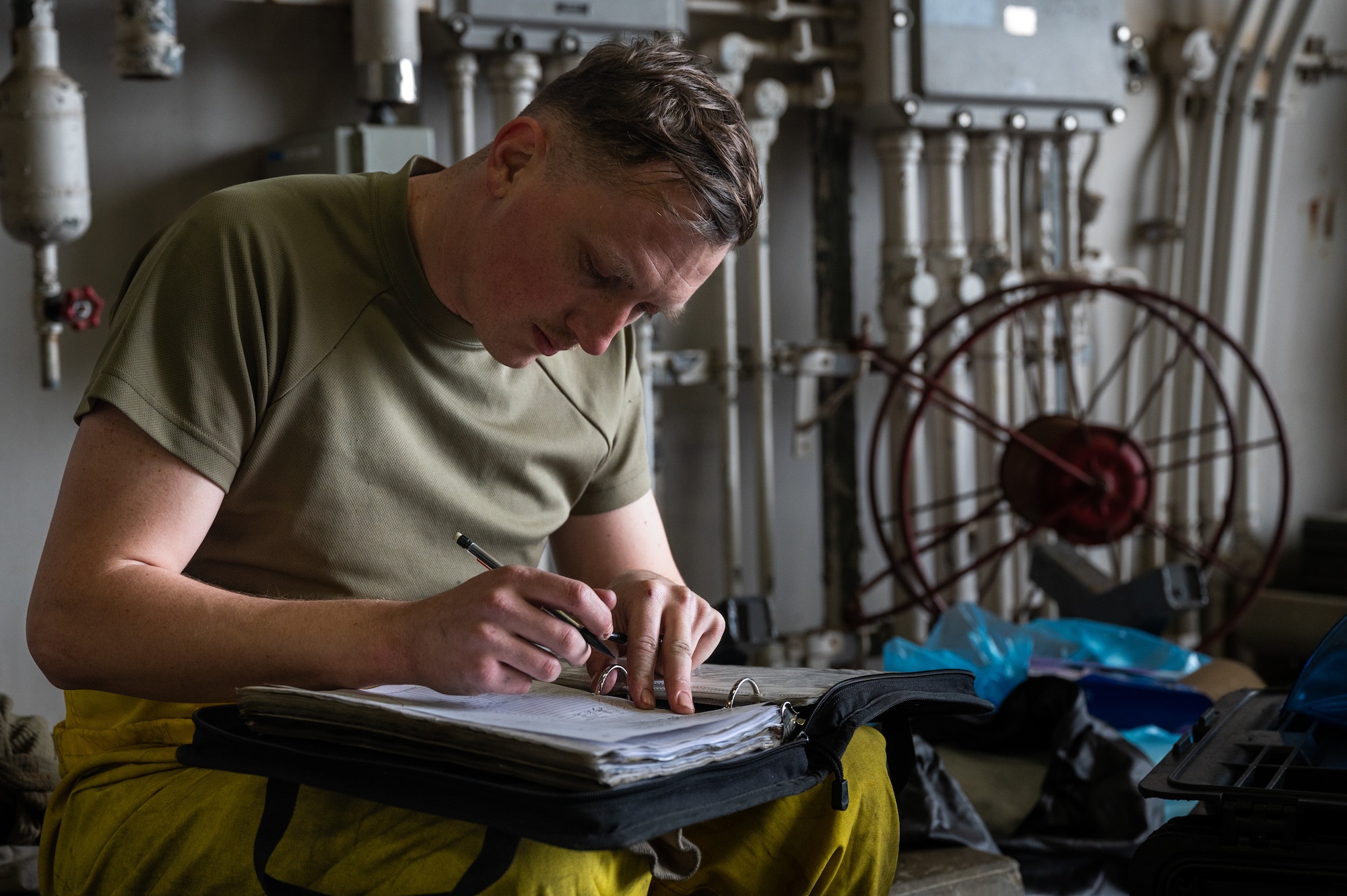 U.S. Air Force Staff Sgt. Tyler Miller, 36th Fighter Generation Squadron crew chief, completes an inspection checklist during the Ninja Mustang training event at Misawa Air Base, Japan, March 6, 2024. Ninja Mustang provided a training opportunity that illustrated the 51st Fighter wing’s ability to relocate within simulated threat timelines and still generate combat power throughout the pacific. The 36th FGS displayed their lethality by sending limited manpower and resources and ensuring that two F-16 Fighting Falcons were properly maintained and fully mission capable for three days. (U.S. Air Force photo by Airman 1st Class Chase Verzaal)