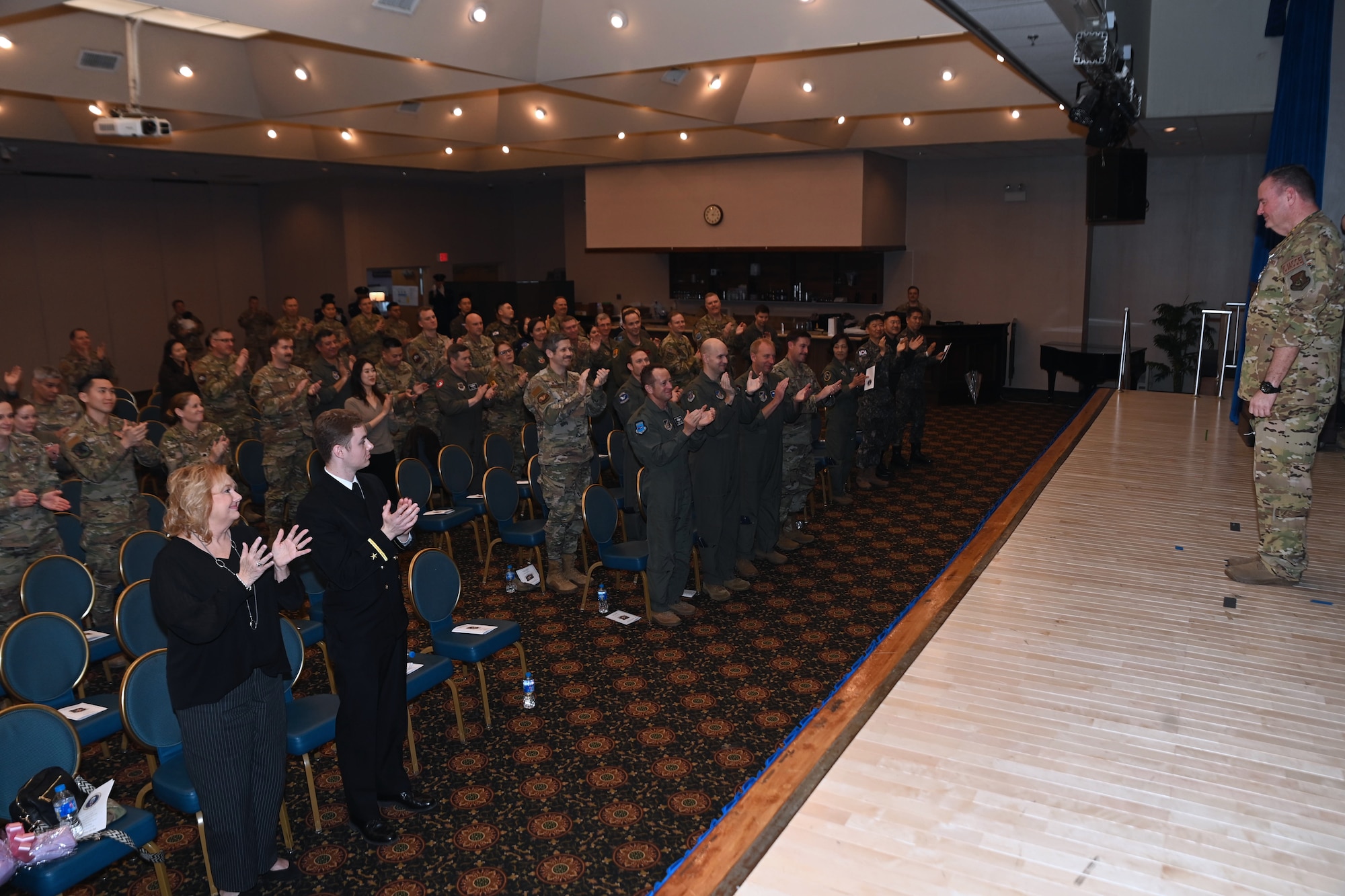 Attendees applaud during the retirement ceremony of Maj. Gen. Daniel Heires, Mobilization Assistant to the Commander, Air Component Command, United Nations Command; Commander, Air Component Command, Combined Forces Command; and Commander, Seventh Air Force, at Osan Air Base, Republic of Korea, March 15, 2024.