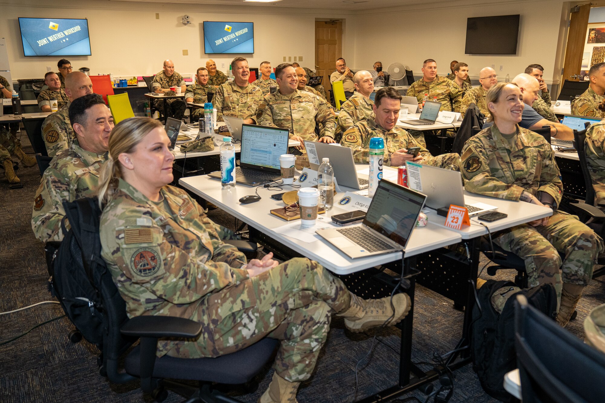 Attendees of the joint weather workshop engage in a brief at Allee Hall on Keesler Air Force Base, Mississippi, March 12, 2024.
