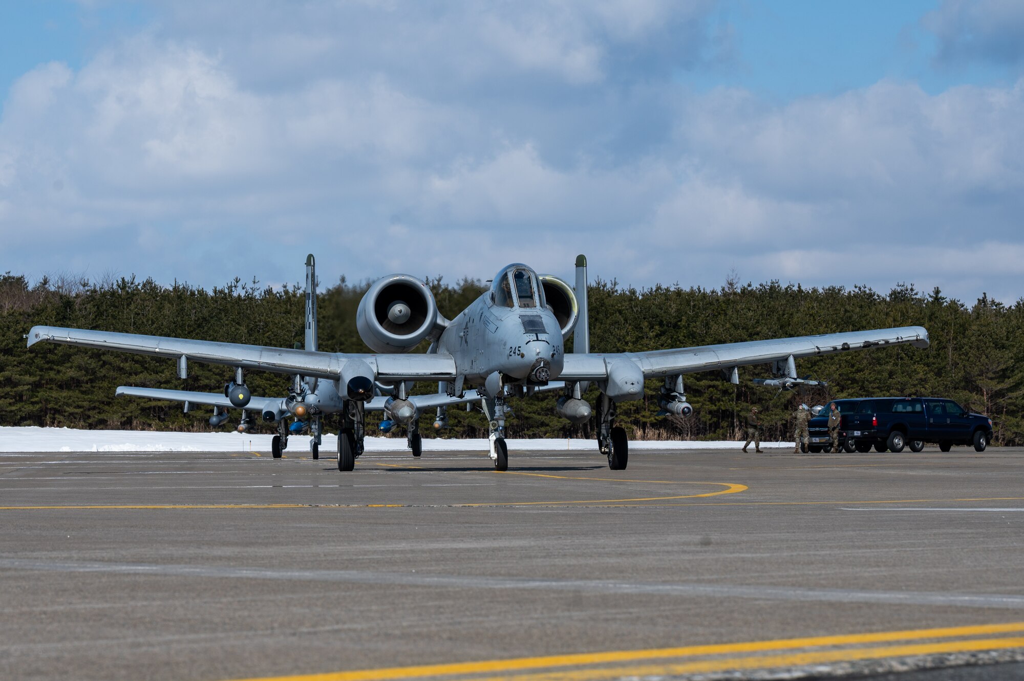 U.S. Air Force A-10C Thunderbolt IIs assigned to the 25th Fighter Squadron, taxi a runway during the Ninja Mustang training event at Misawa Air Base, Japan, March 7, 2024. Ninja Mustang allowed the 51st FW to integrate with other units throughout the pacific theater, to strengthen the agile combat employment of the 51st FW. ACE ensures the 51st FW remains adaptable in new situations, maintains readiness to counter emerging threats and sustain operational effectiveness with our allies. (U.S. Air Force photo by Airman 1st Class Chase Verzaal)