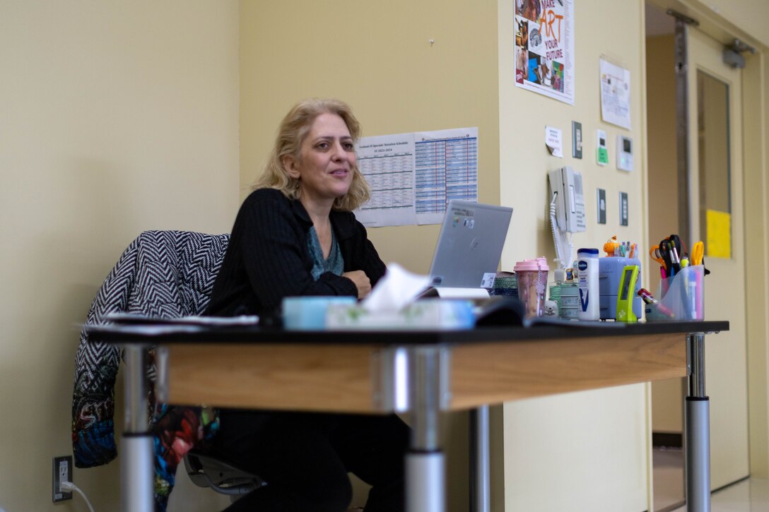 Nicole Colburn, a Department of Defense Education Activity (DoDEA) art teacher at Iwakuni Intermediate School, looks around her classroom at Marine Corps Air Station Iwakuni, Japan, Jan. 12, 2024. A native of Shirley, Massachusetts, Colburn teaches art as a way to follow her passion for the history, culture, and creativity of art. (U.S. Marine Corps Photo by Cpl. Peter Rawlins)