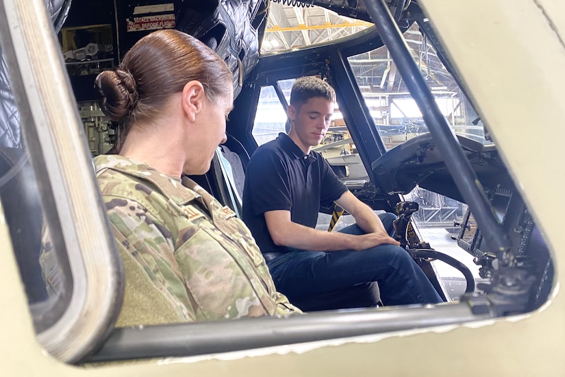 Isaac Bell, right, a Pennsylvania Army National Guard recruit who enlisted through the 09W program, checks out the cockpit of a CH-47 Chinook helicopter during an enlistment and swearing-in ceremony at Muir Army Heliport at Fort Indiantown Gap, Pennsylvania, March 15, 2024. The 09W program, also known as “streets to seats” or “high school to flight school” provides a path to flight school after basic training for enlistees who are selected in a rigorous selection process. (U.S. Army National Guard photo by Maj. Travis Mueller)