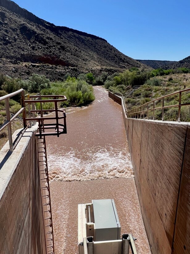 A rare view of water flowing through the Jemez Canyon Dam outlet works, near Rio Rancho, N.M., June 16, 2023.