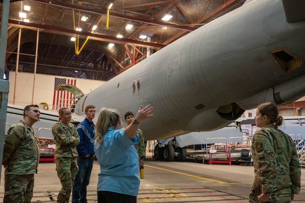 Jessica Walser, 97th Aircraft Maintenance Squadron KC-135 Stratotanker inspection work leader, shows Air Force ROTC (AFROTC) cadets from Baylor University a KC-135 during a tour at Altus Air Force Base, Oklahoma, March 15, 2024. Walser explained some of the air refueling capabilities of the aircraft to the AFROTC attendees. (U.S. Air Force photo by Airman 1st Class Heidi Bucins)