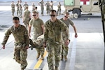 Combat medics from the 56th Stryker Brigade Combat Team who are deployed to the Horn of Africa conduct joint medical evacuation cold-load training aboard a KC-130J aircraft at Camp Lemonnier, Djibouti, March 5, 2024. The training ensures interoperability with key U.S. military assets to expedite patient transfers to and from an aircraft in the event lifesaving measures and medical evacuation are requested.