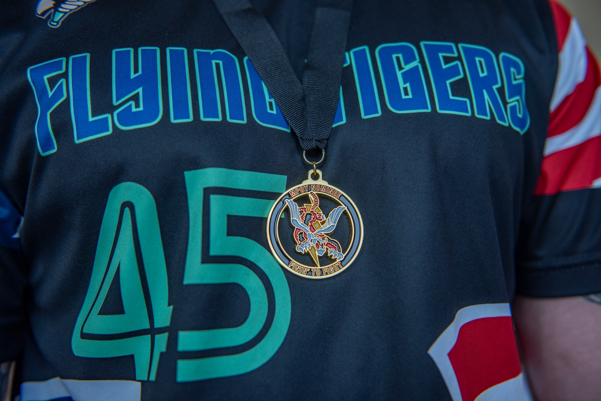 medal rest on the chest of an Airman