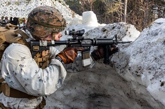 HM3 William DeBruler, assigned to the 2nd Marine Logistics Group, provides security during Exercise Nordic Response 24 in Alta, Norway.