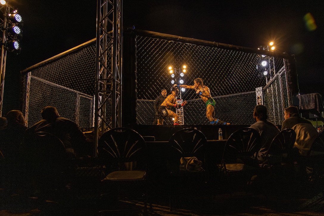 Amateur fighters participate in an MMA Fight Night held at the School of Infantry-West parade deck at Marine Corps Camp Pendleton, California, March 15, 2024. The MMA Fight Night consisted of amateur fighters going head-to-head in eight sanctioned bouts. This event was coordinated by Marine Corps Community Services Camp Pendleton to promote base cohesion, increase morale, provide entertainment, and to prioritize quality of life for Marines, Sailors, and families. (U.S. Marine Corps photo by Lance Cpl. Mhecaela J. Watts)