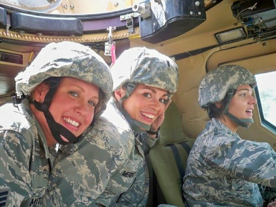 U.S. Air Force Lt. Col. Danielle Merritt, currently serving as the 9th Operational Medical Readiness Squadron commander, sits in a High Mobility Multipurpose Wheeled Vehicle (Humvee) with other medics while on deployment in Iraq, 2010.