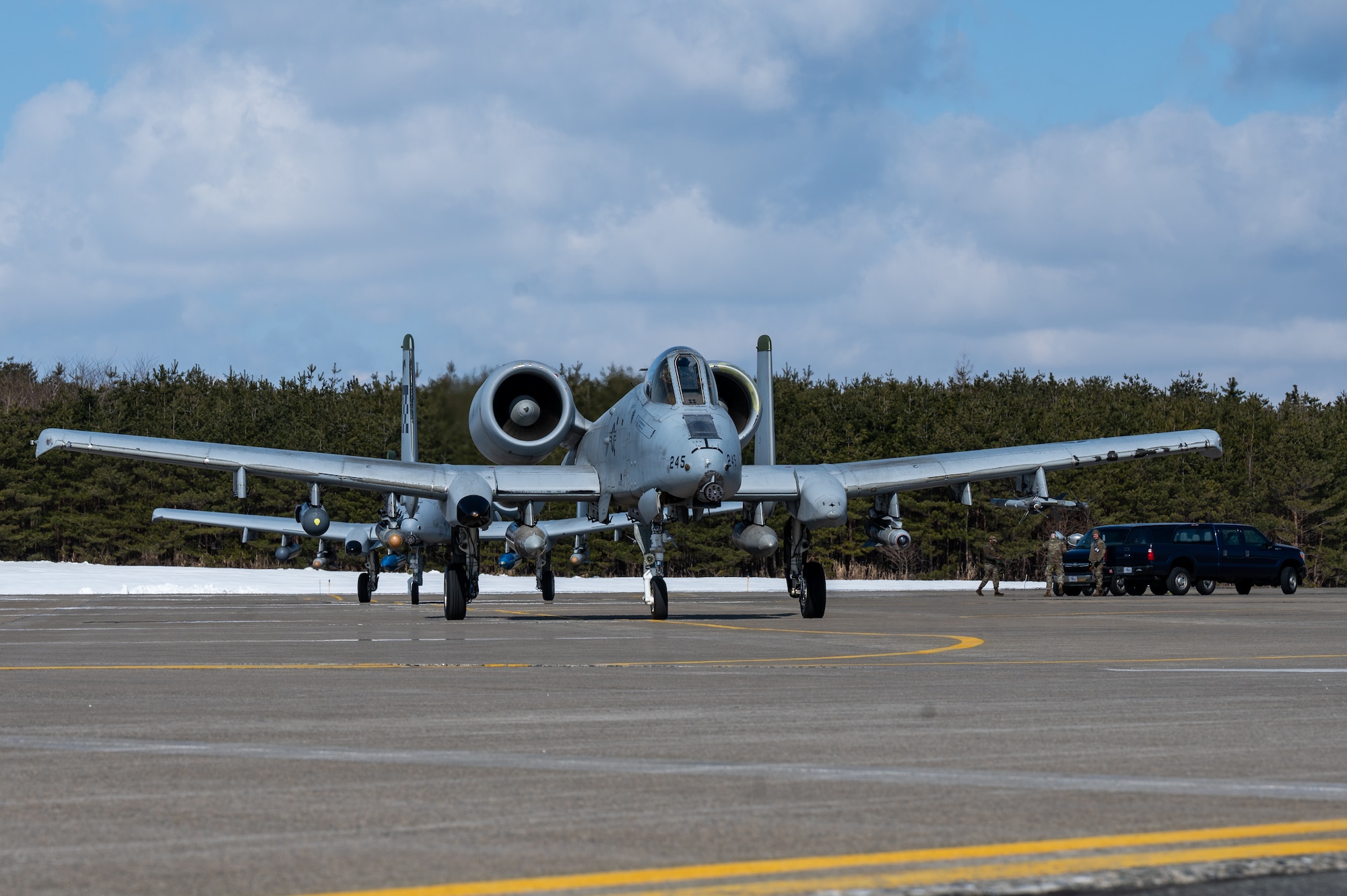 U.S. Air Force A-10C Thunderbolt IIs assigned to the 25th Fighter Squadron, taxi a runway during the Ninja Mustang training event at Misawa Air Base, Japan, March 7, 2024. Ninja Mustang allowed the 51st FW to integrate with other units throughout the pacific theater, to strengthen the agile combat employment of the 51st FW. ACE ensures the 51st FW remains adaptable in new situations, maintains readiness to counter emerging threats and sustain operational effectiveness with our allies. (U.S. Air Force photo by Airman 1st Class Chase Verzaal)