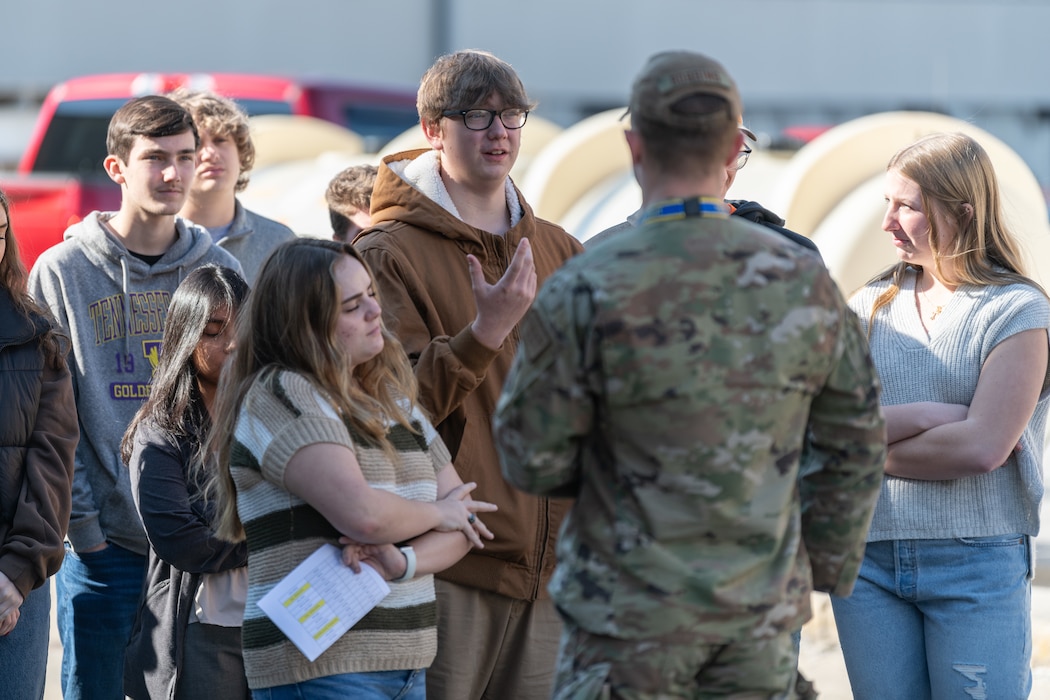 High school juniors and seniors tour facilities at for the Engineer-For-A-Day program, at Arnold Air Force Base, Tenn., Feb. 21, 2024. 2nd Lt. Patrick Robbins, who was on hand for the day’s event, answers a student’s questions about the base.