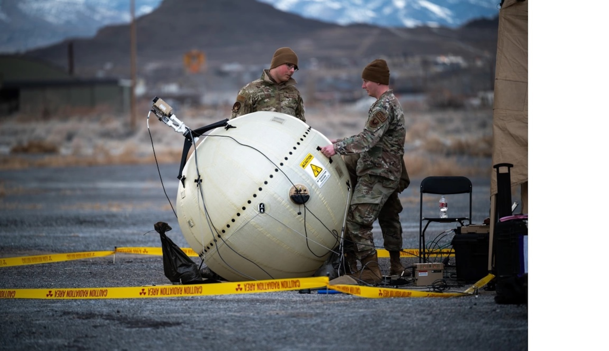 U.S. Air Force Senior Airman Andrey Almann, a Tactical Communications specialist, watches Staff Sgt. Alex Hoover, a Tactical Communications supervisor both assigned to the 27th Special Operations Communications Squadron, align a GATR SATCOM terminal during exercise Emerald Warrior 24 at Wendover Airport, Utah, March 5, 2024. Emerald Warrior provides annual realistic, relevant, high-end pre-deployment training in a complex and evolving security environment using all aspects of live, virtual and constructive training aspects. (U.S. Air Force photo by Senior Airman Keegan Putman)