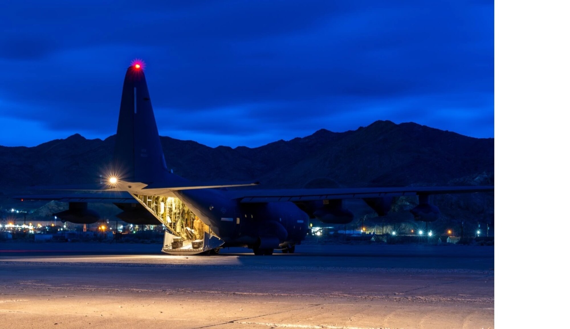 An MC-130J Commando II assigned to the 9th Special Operations Squadron sits on the flightline after unloading personnel and cargo during exercise Emerald Warrior 24 at Wendover Airport, Utah, March 5, 2024. Agile Combat Employment concepts employed by Air Force Special Operations Command such as Mission Sustainment Teams provide the placement, access and survivability needed within contested and denied environments. (U.S. Air Force photo by Senior Airman Keegan Putman)