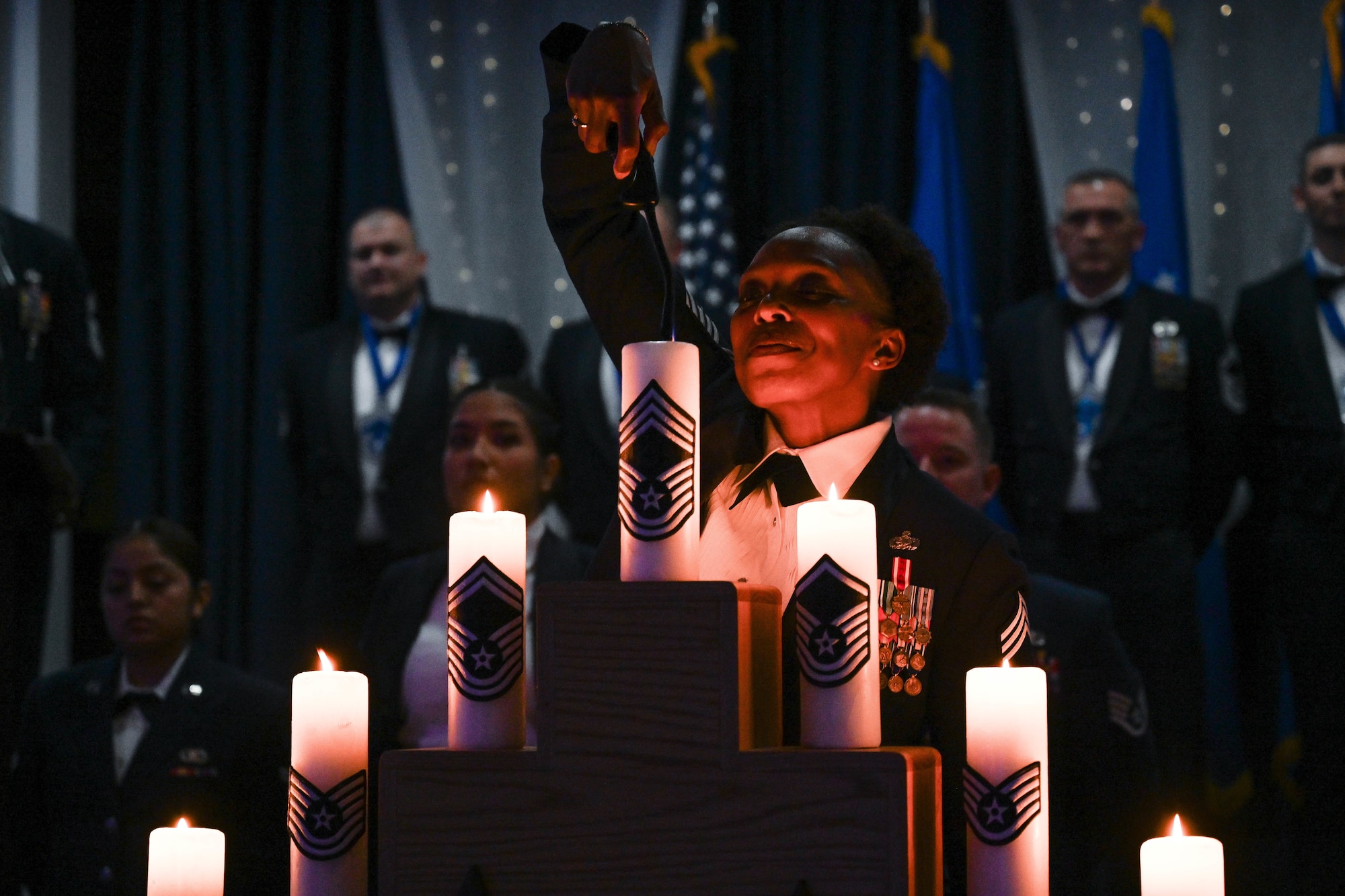 Airman lights candle