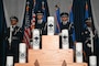 Barksdale Honor Guard stands on stage behind candles