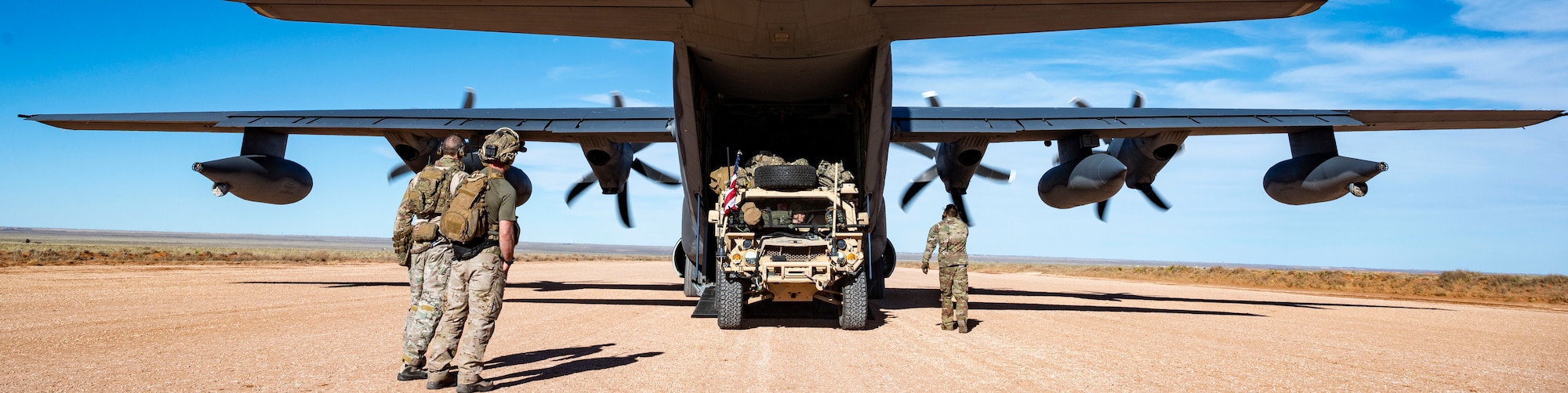 Airman 1st Class Karl Vincent Santos, 9th Special Operations Squadron loadmaster, prepares to load a GMV 1.1 onto a MC-130J Commando II during exercise Emerald Warrior 24 at Cannon Air Force Base, N.M., March 4th, 2024. Emerald Warrior provides annual, realistic, relevant, high-end pre-deployment training in a complex and evolving security environment using all aspects of live, virtual and constructive training assets. (U.S. Air Force photo by Staff Sgt. Aaron Irvin)