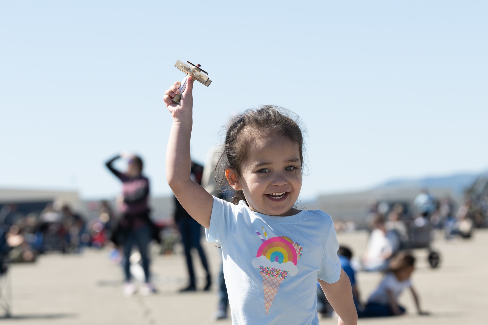 a child playing with a toy airplane
